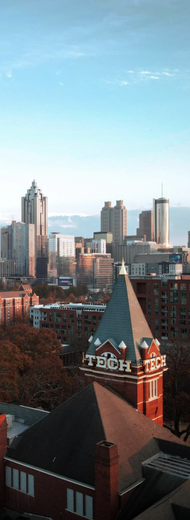 GT campus from above with Atlanta skyline in the background