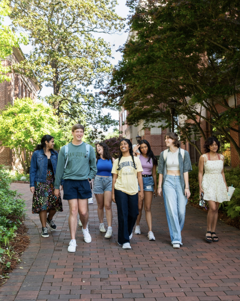 students walking outside on campus