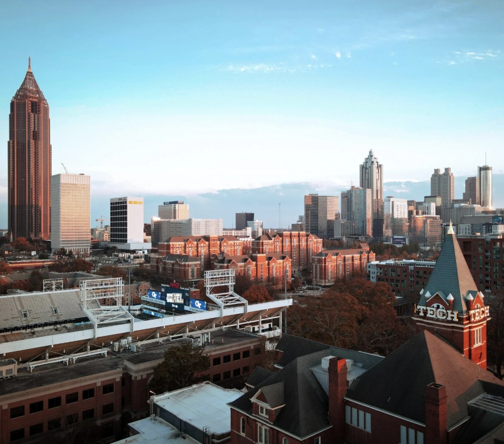GT campus from above with Atlanta skyline in the background